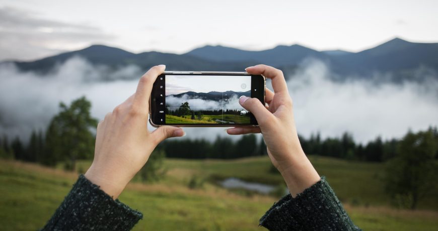 woman-taking-photo-rural-surroundings
